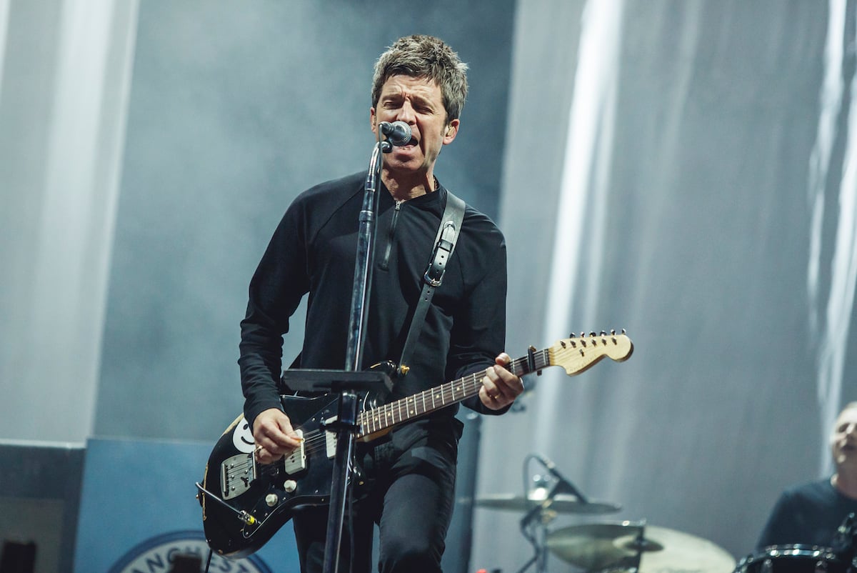Noel Gallagher performing on stage