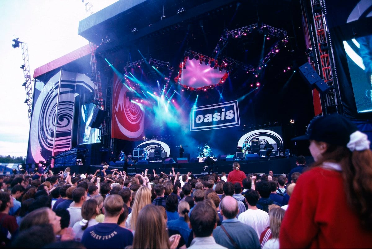 Oasis performs on stage