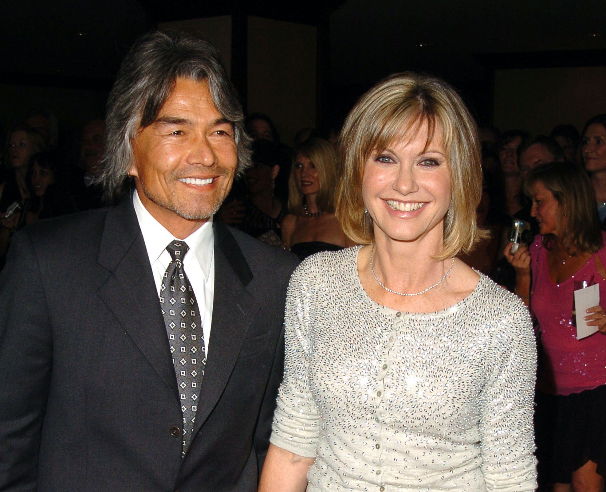 Olivia Newton-John (right) with boyfriend Patrick McDermott in January 2005. Newton-John once said she didn't think she "would ever be at peace" after McDermott's mysterious 2005 disappearance on a fishing trip.