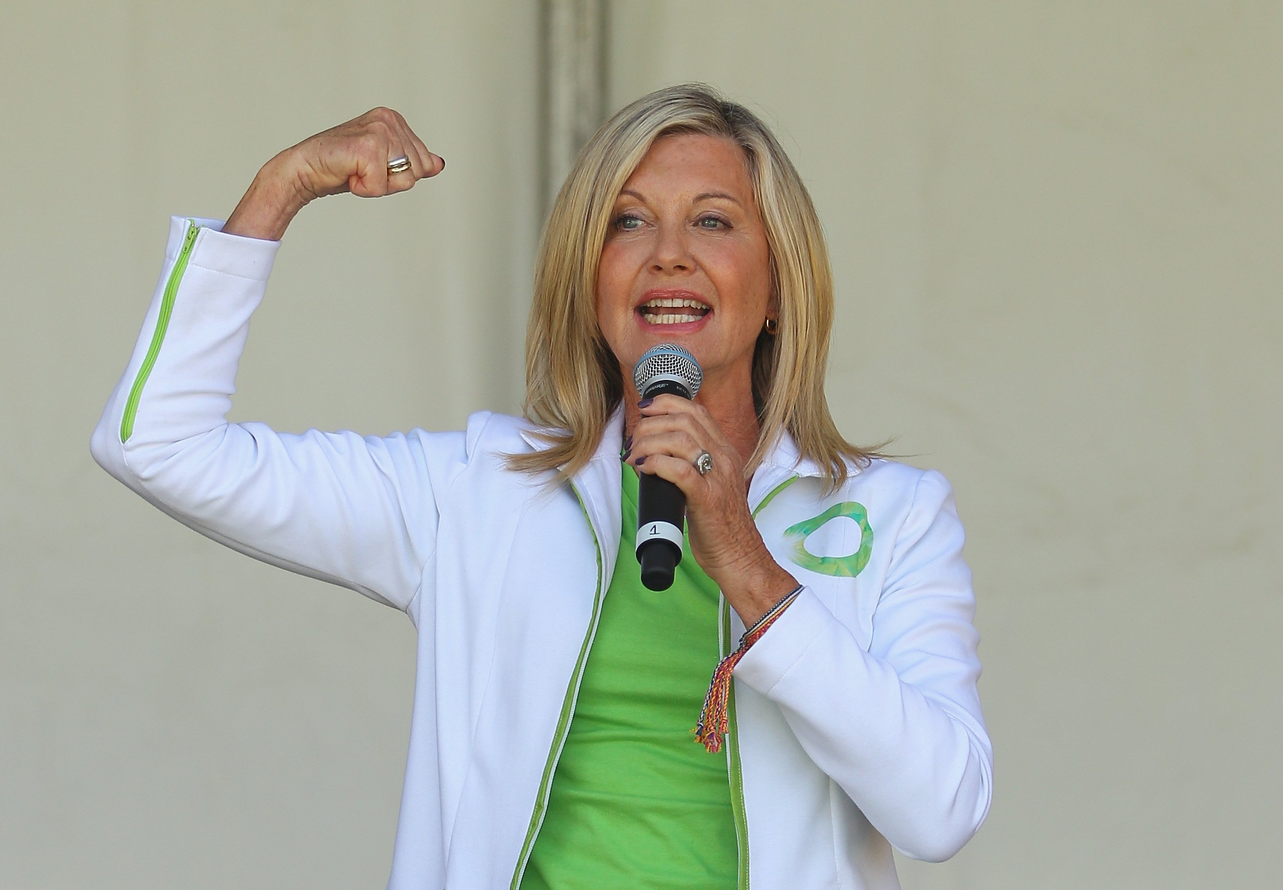 Olivia Newton-John, who once said she didn't fear of death, performing her song Physical on stage before leading the inaugural Wellness Walk