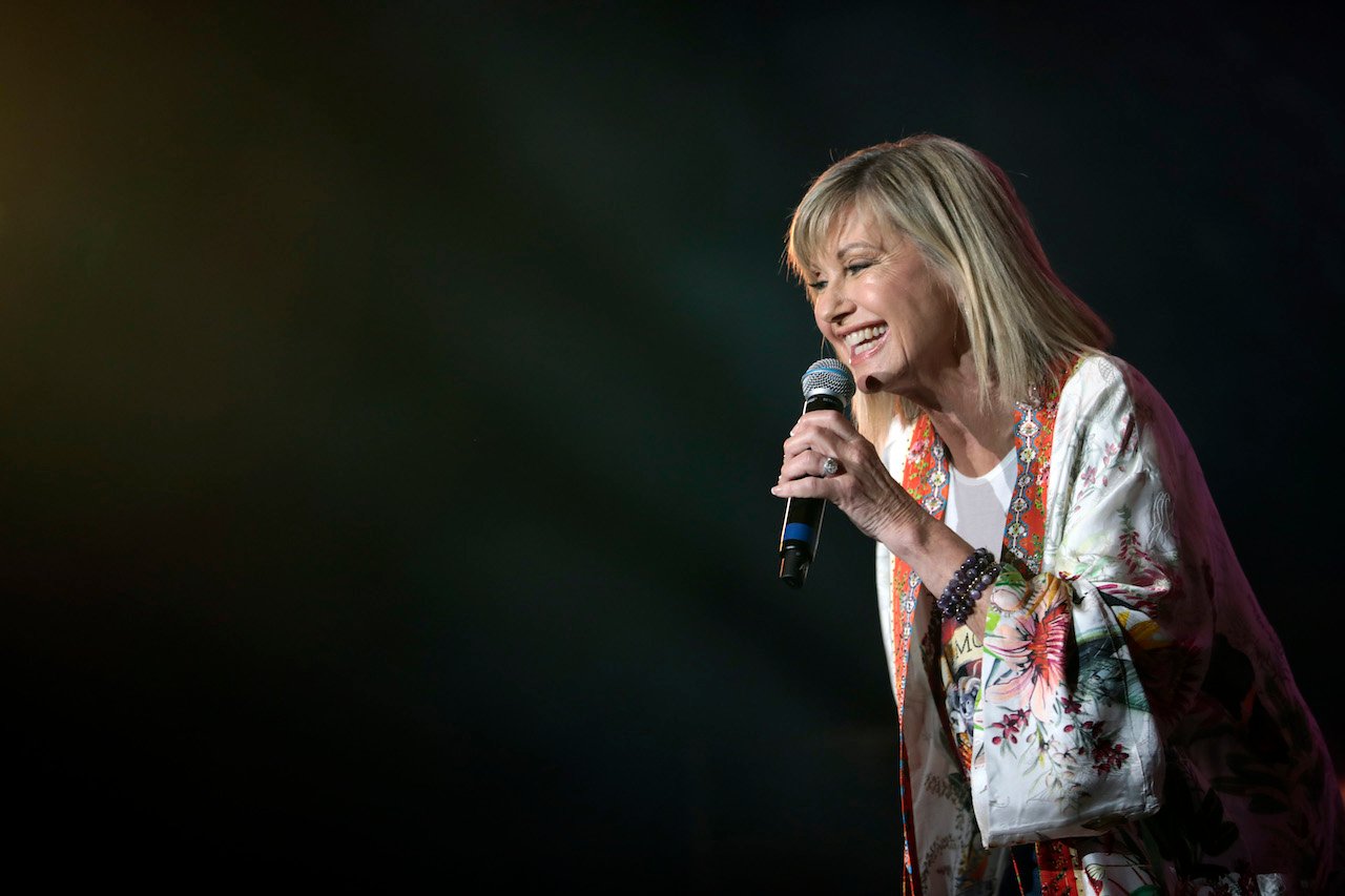 Olivia Newton-John, shown performing in 2020, is dead at 73