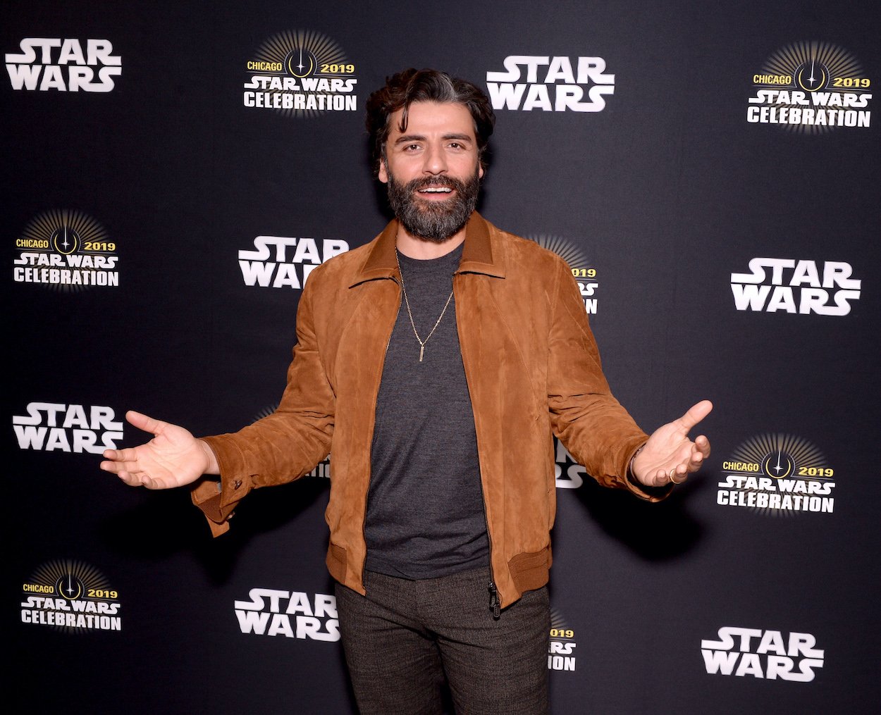 Oscar Isaac attends the 2019 'Star Wars' Celebration in Chicago. After once joking about playing Poe Dameron again, Isaac gave a serious answer about what it would take for him to make his 'Star Wars' return.