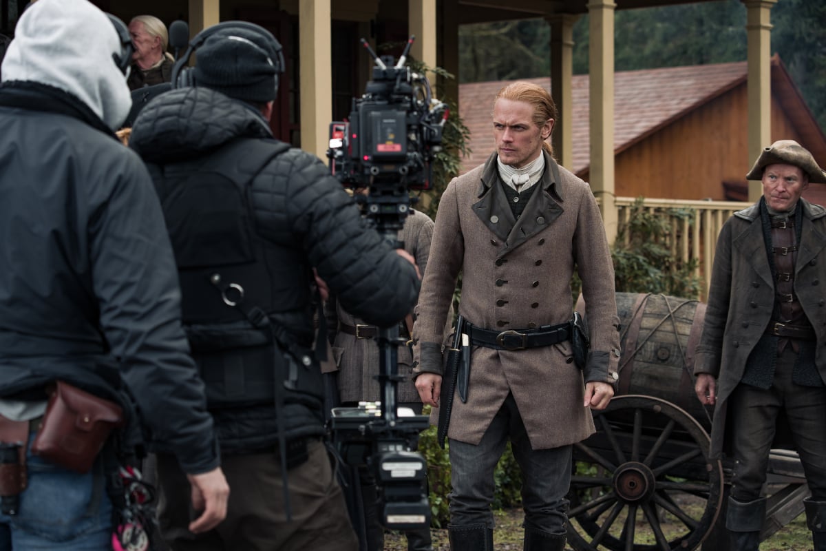 Outlander star Sam Hueghan as Jamie Fraser in a behind-the-scenes photo from shooting season 6 of the Start drama