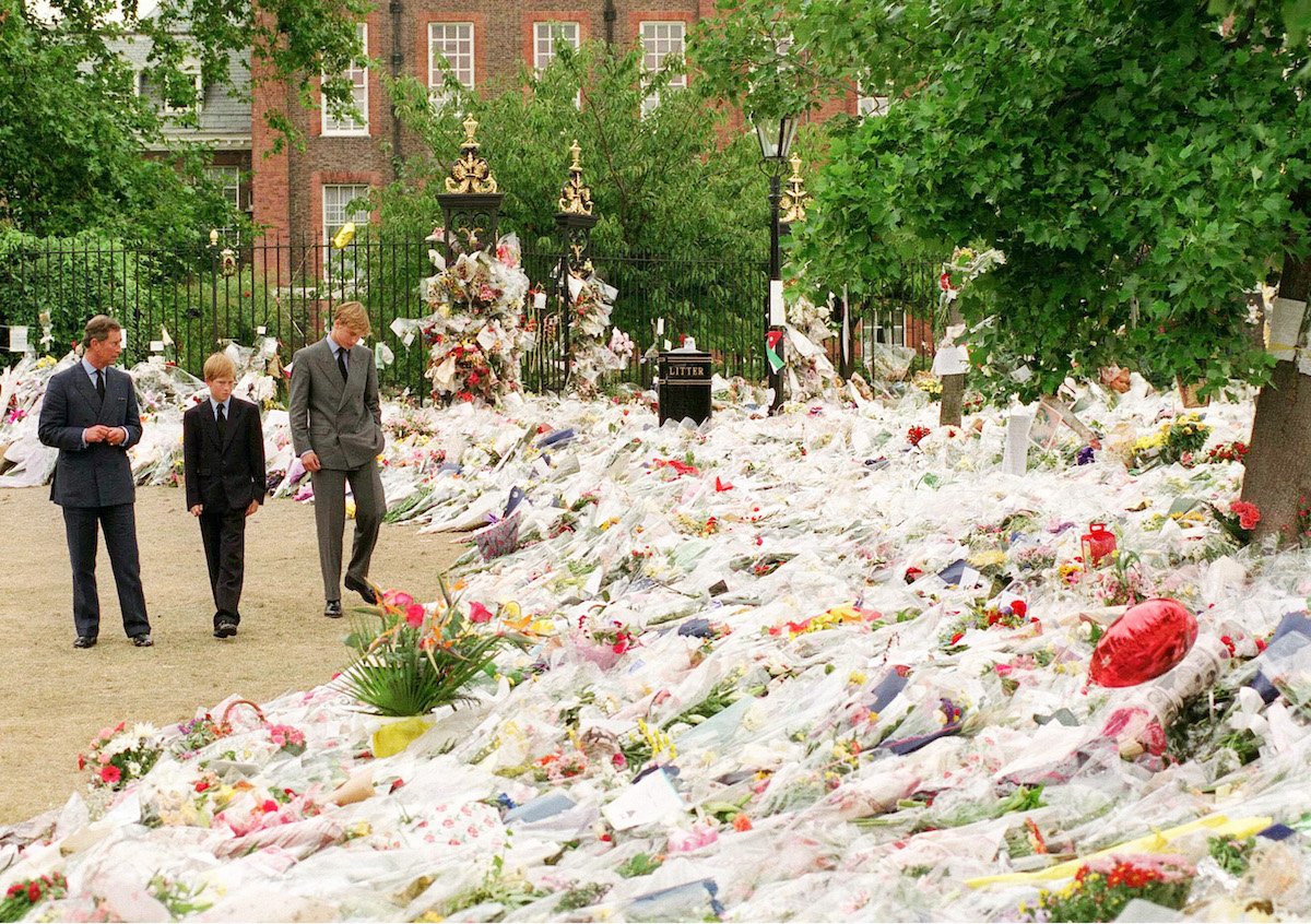 Prince Charles, Prince Harry, who found the reaction to Princess Diana's death 'very strange,' and Prince William walk outside Kensington Palace after Princess Diana's death