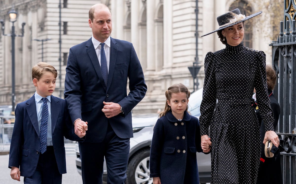 Kate Middleton, who received praise for how she shushed Princess Charlotte at Prince Philip's memorial, walks with Prince George, Prince William, and Princess Charlotte
