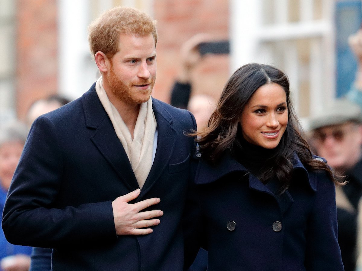 Prince Harry and Meghan Markle, who interviewed Mariah Carey on 'Archetypes', walks with Prince Harry