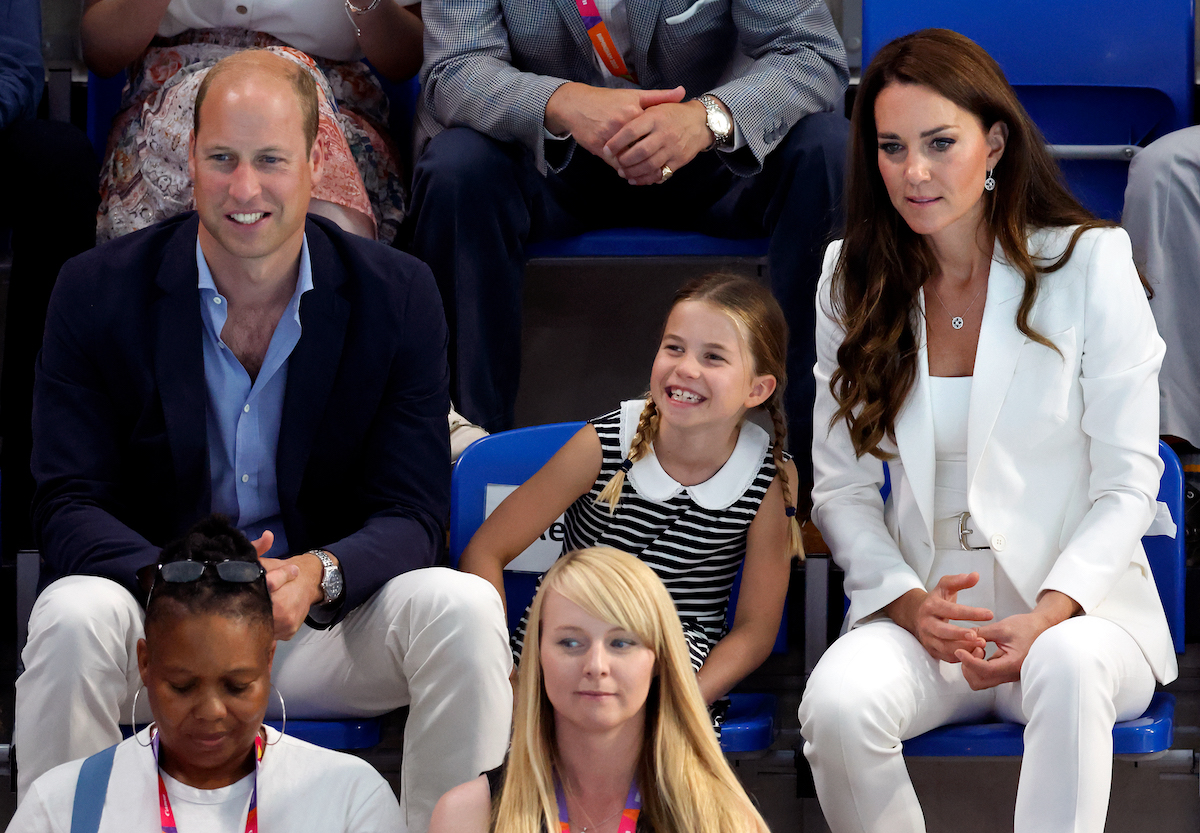 Princess Charlotte, whose Commonwealth body language suggested a new phase of her relationship with Kate Middleton, sits in between Prince William and Kate Middleton