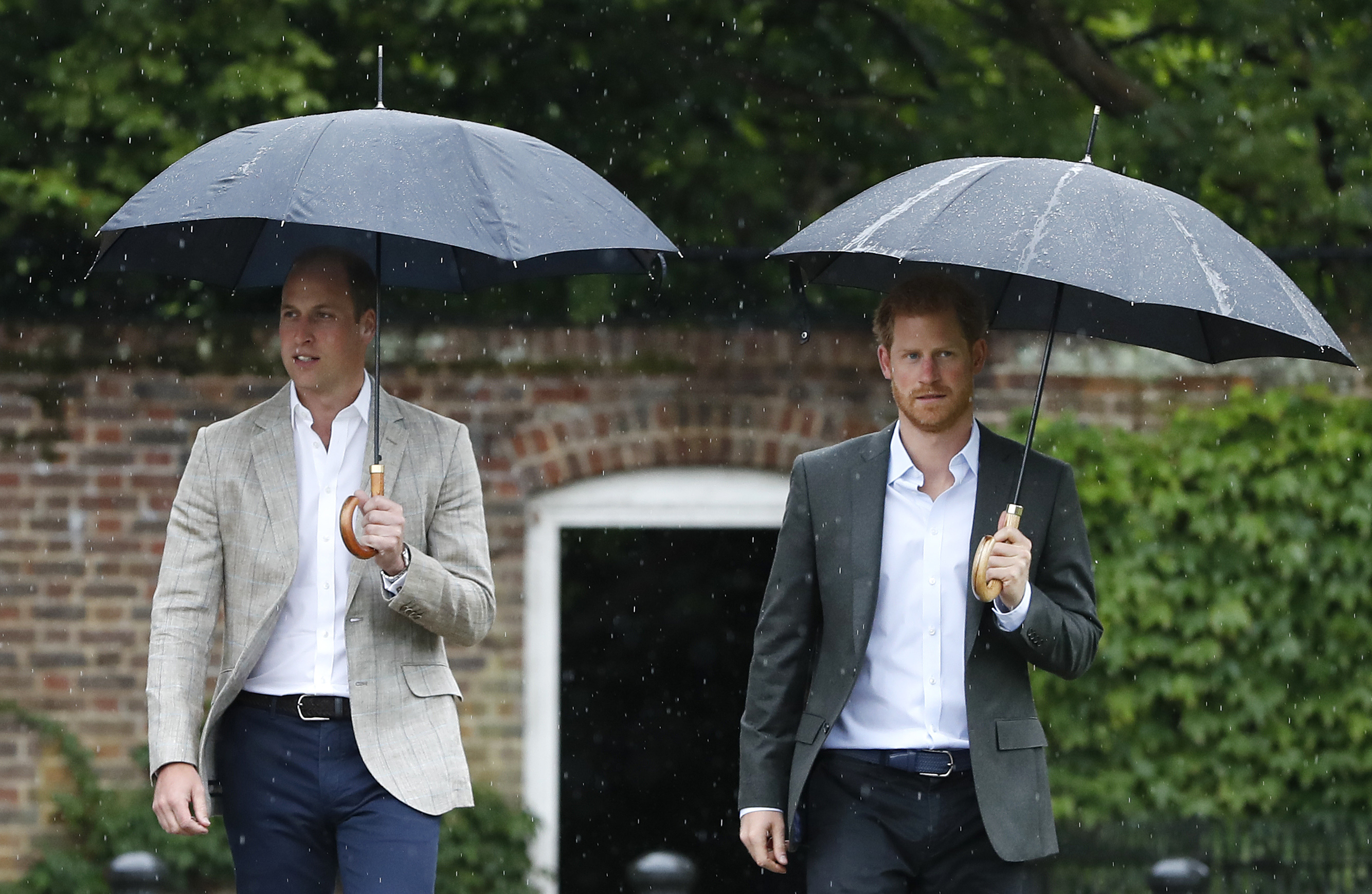 Prince William and Prince Harry are seen during a visit to The Sunken Garden at Kensington Palace