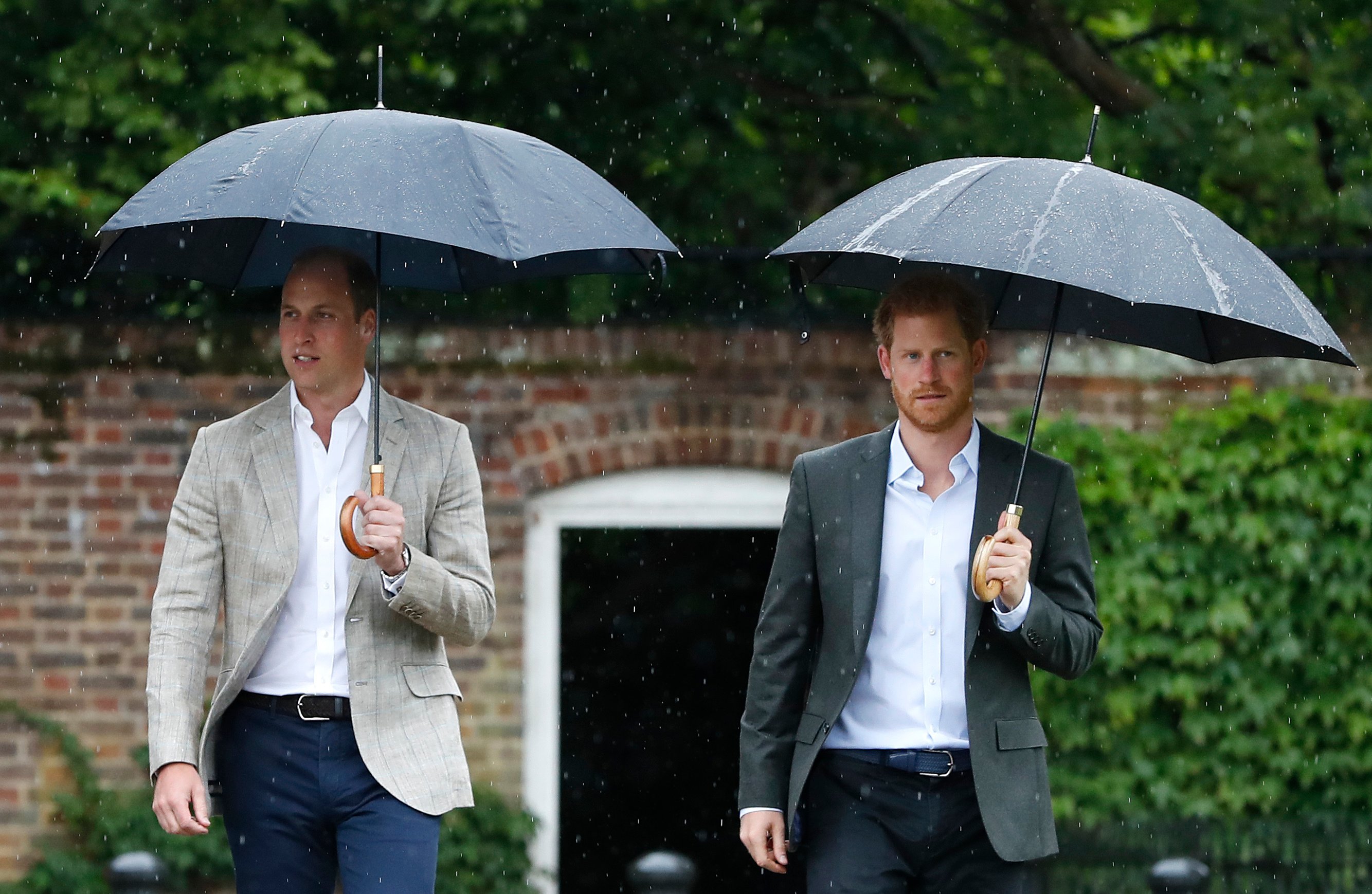 Prince William and Prince Harry are seen during a visit to The Sunken Garden at Kensington Palace