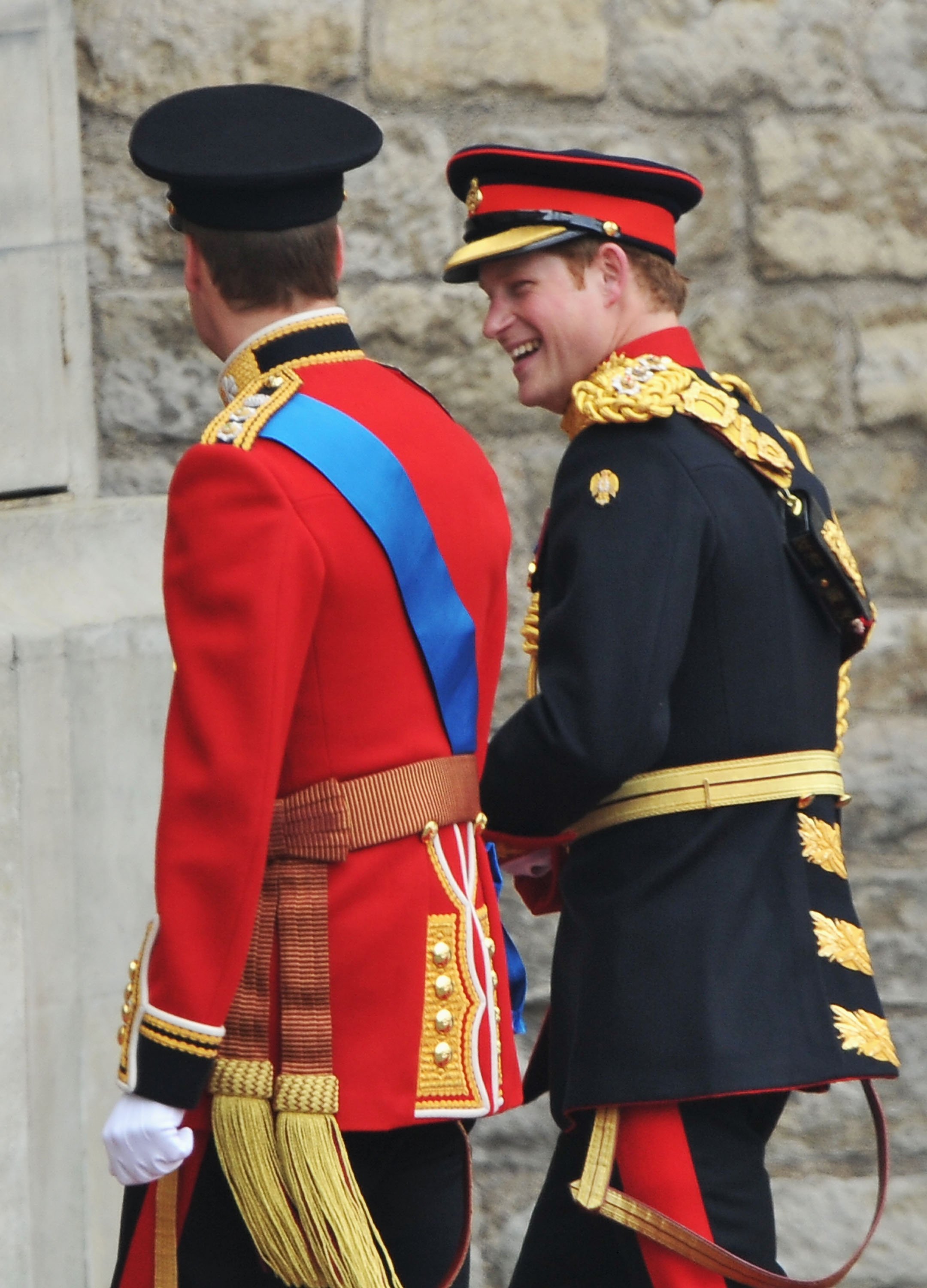 Prince William and Prince Harry share a joke as they arrive to Westminster Abbey for William's wedding to Kate Middleton