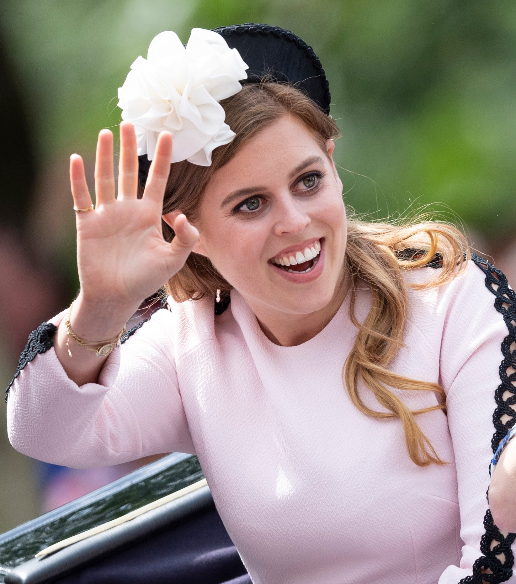 Princess Beatrice waves from carriage during Trooping the Color