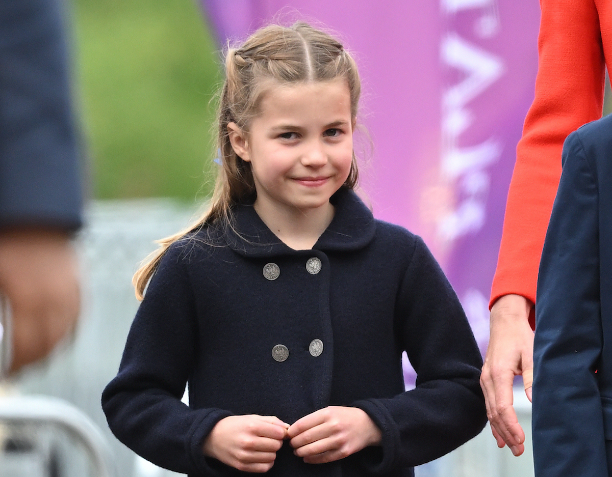 Princess Charlotte, who body language expert Judi James said appeared confident and in control in a video with Prince William, walks with her hands in front of her