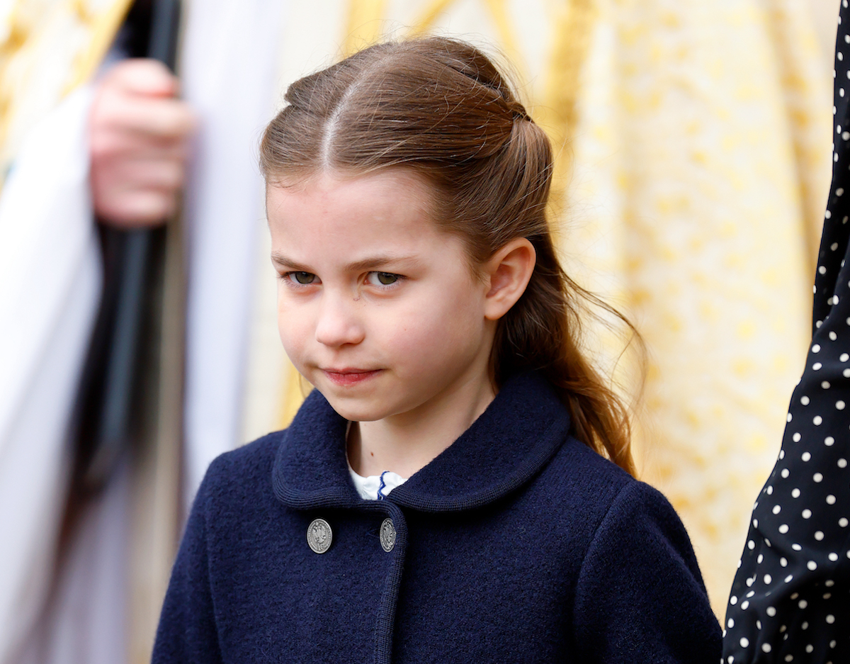 Princess Charlotte, who Kate Middleton shushed at. Prince Philip's memorial, arrives at Westminster Abbey wearing a blue coat