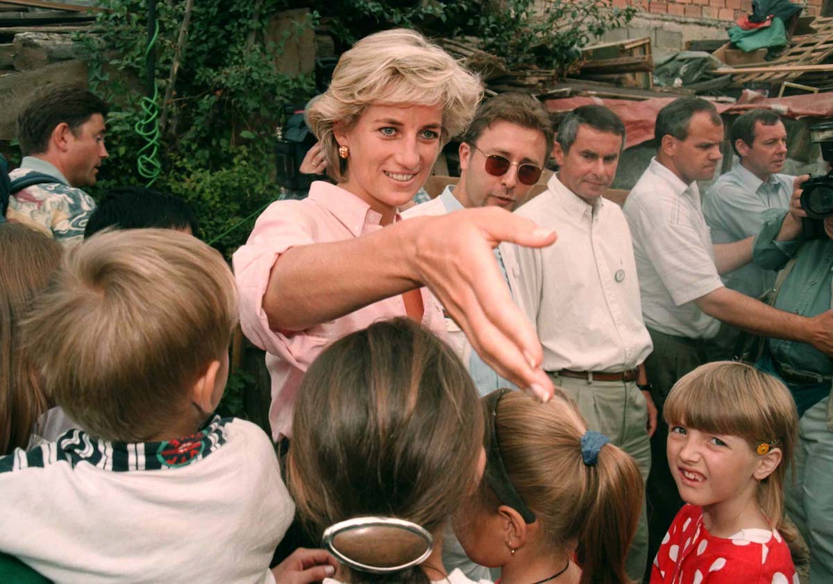 Princess Diana, seen in one of the last photos taken before death on Aug. 31, 1997, greets children in Sarajevo