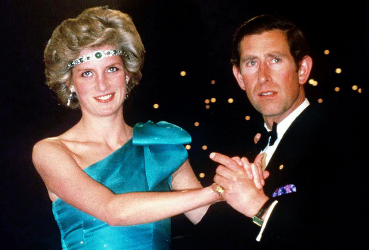 Princess Diana Is Wearing A Diamond And Emerald Choker (a Wedding Gift From The Queen) As A Headband With A One-shouldered Turquoise Satin Organza Dress Designed By David And Elizabeth Emanuel