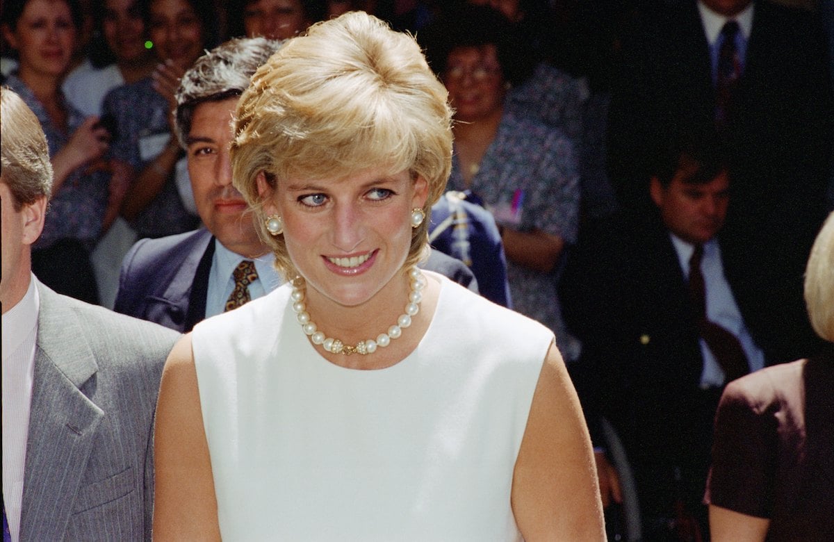 Princess Diana, whose BBC interview Andrew Morton believes should be 'part of the public record,' smiles and looks on wearing a white dress