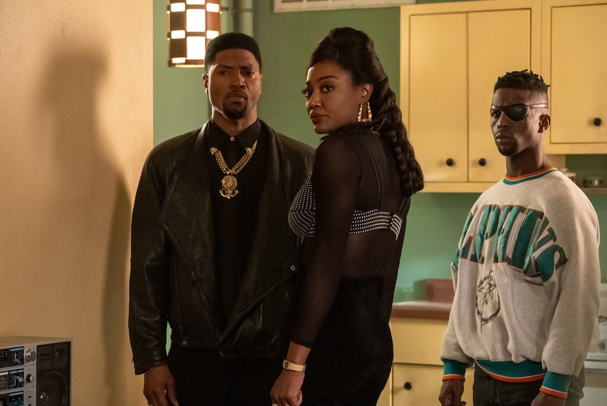 London Brown as Marvin Thomas, Patina Miller as Raq Thomas and Ade Chike Torbert as Scrappy standing in the kitchen in 'Power Book III: Raising Kanan'