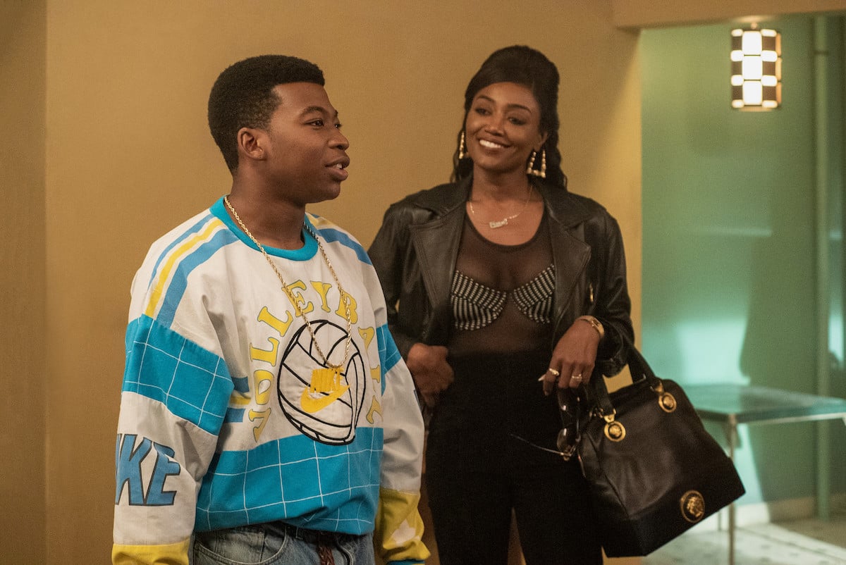 Mekai Curtis as Kanan Stark and Patina Miller as Raquel Thomas smiling and conversing in 'Power Book III: Raising Kanan'