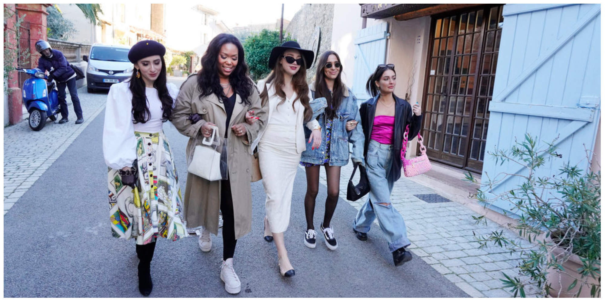 Anya Firestone, Adja Toure, Emily Gorelik, Margaux Lignel, Victoria Zito from 'Real Girlfriends in Paris' walk down the street arm in arm