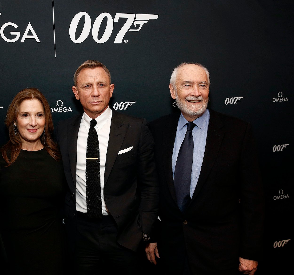Barbara Broccoli (from left), Daniel Craig, and Michael G. Wilson attend an Omega watch unveiling in 2019. With Craig leaving the role, the hunt for the next James Bond includes specific requirements that rule out Idris Elba and Tom Hardy.
