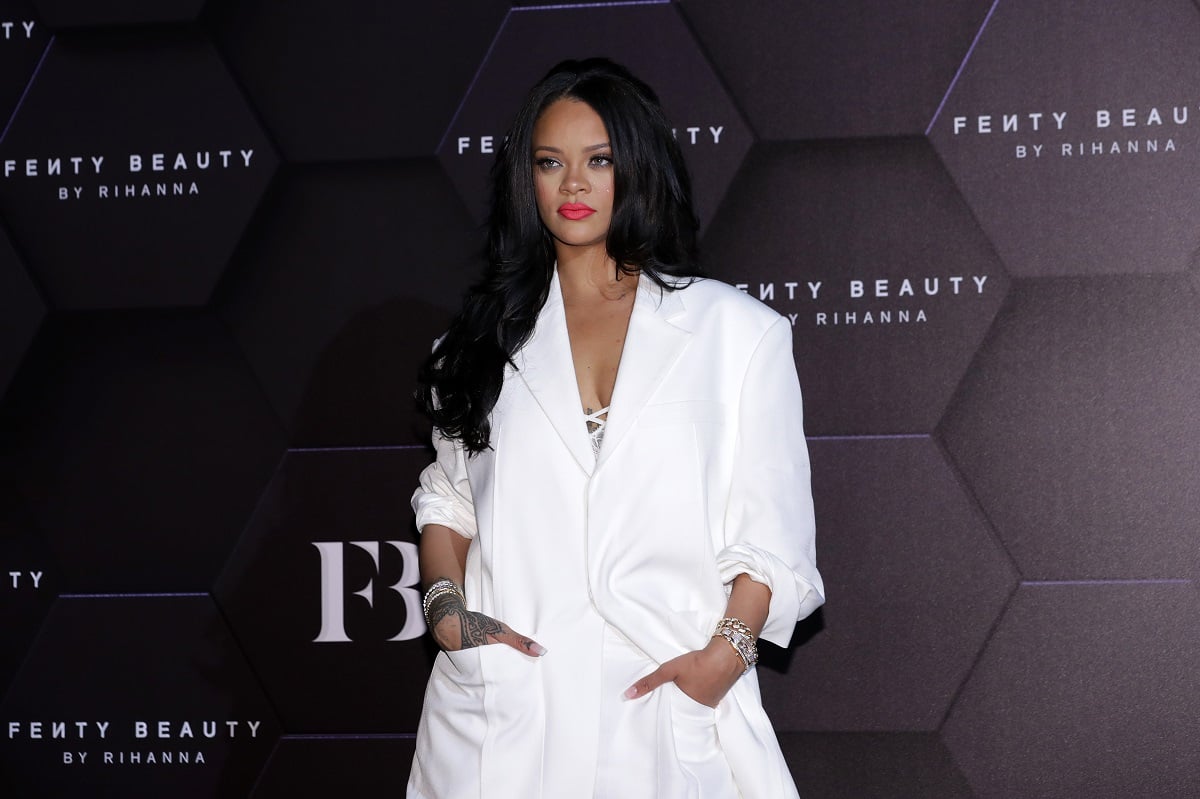 Rihanna poses at an event for Fenty Beauty.