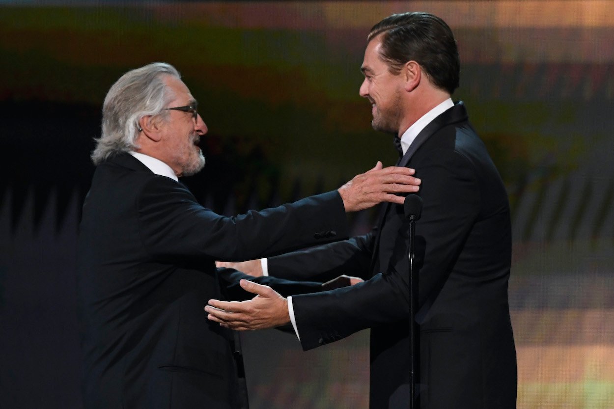 Robert De Niro (left) and Leonardo DiCaprio embrace as De Niro receives the Screen Actors Guild Life Achievement Award in 2020. DiCaprio and De Niro worked together on one movie, which was enough for De Niro to recommend him to Martin Scorsese.