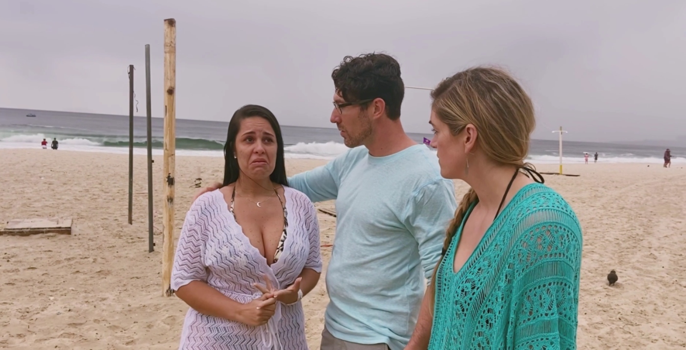 Roberta Pache cries as she talks with her fiancé, Garrick, and her sister wife, and Dannielle Merrifield on the beach during 'Seeking Sister Wife' Season 4.