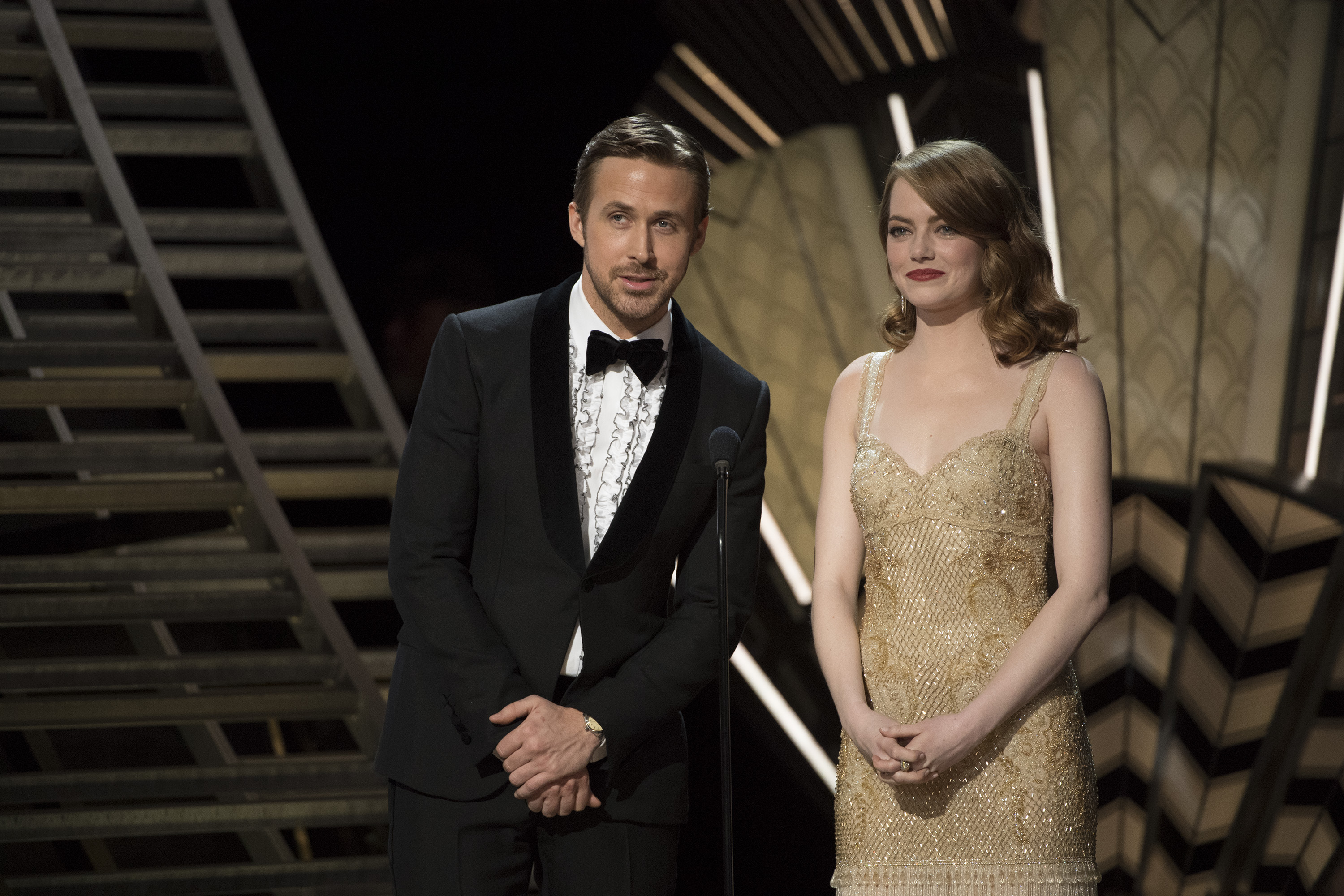 Ryan Gosling and Emma Stone present on stage at the 2017 Academy Awards