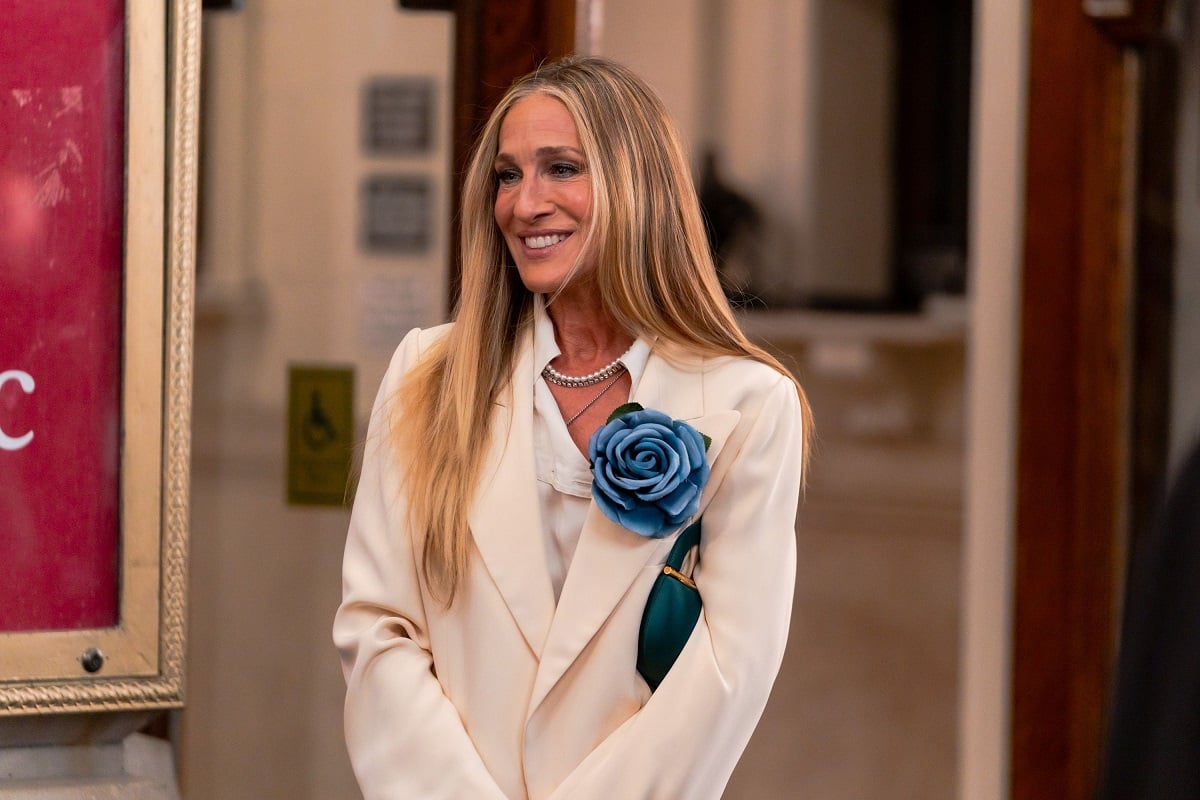 Sarah Jessica Parker smiling while filming 'And Just Like That.'