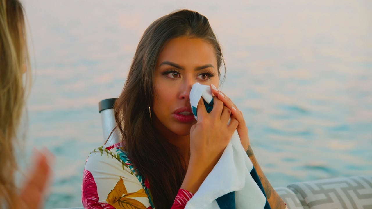 Kayla Cardona wipes a tear from her eye with a napkin from 'Selling The OC'.