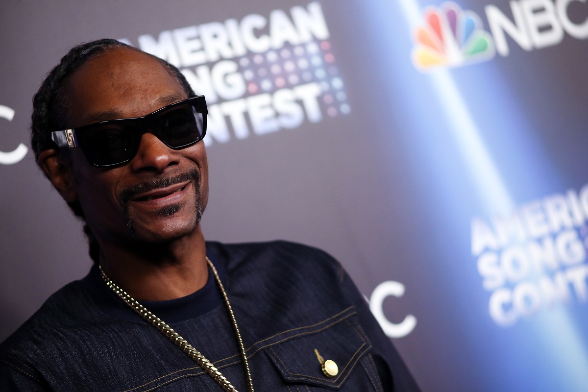 Snoop Dogg posing while wearing sunglasses