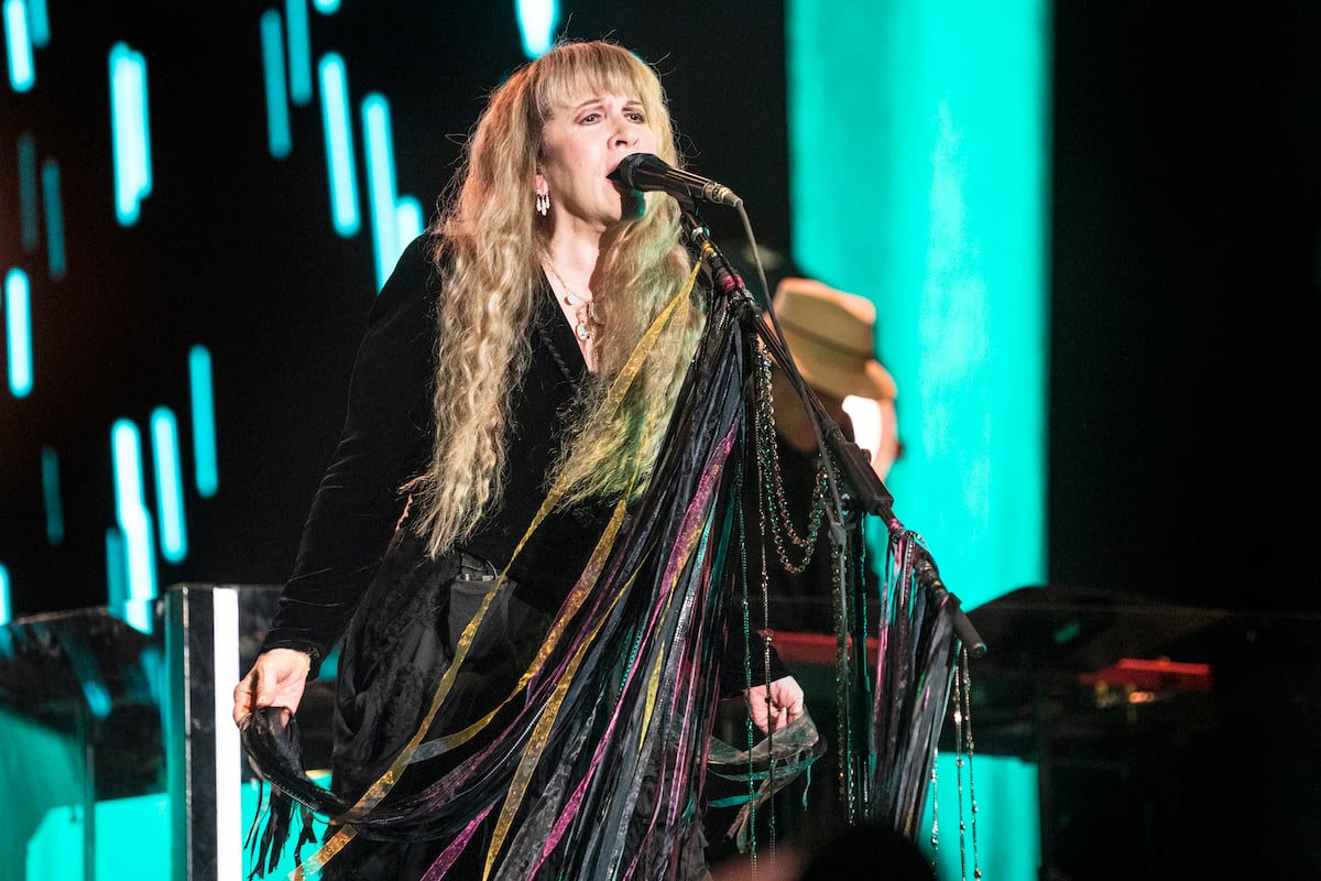 Stevie Nicks, who once said she would give Christine McVie $5 million to return to Fleetwood Mac, performing on stage.