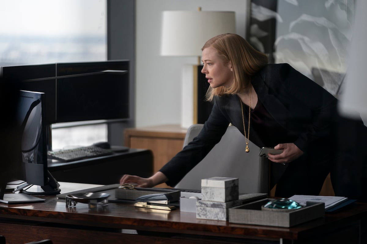'Succession': Sarah Snook leans over her desk looking at her computer
