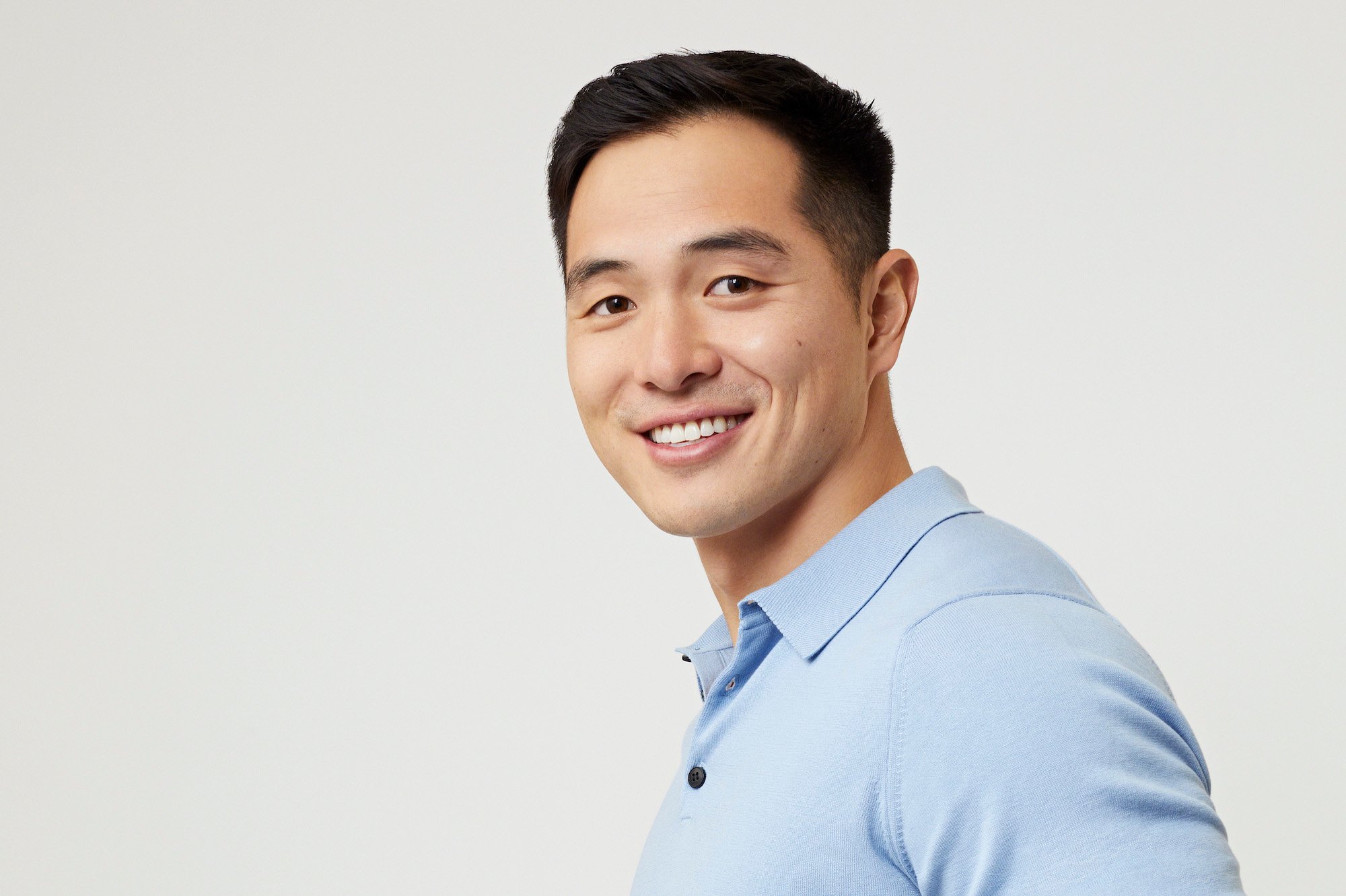 'The Bachelorette' star Ethan Kang wearing a blue polo shirt.