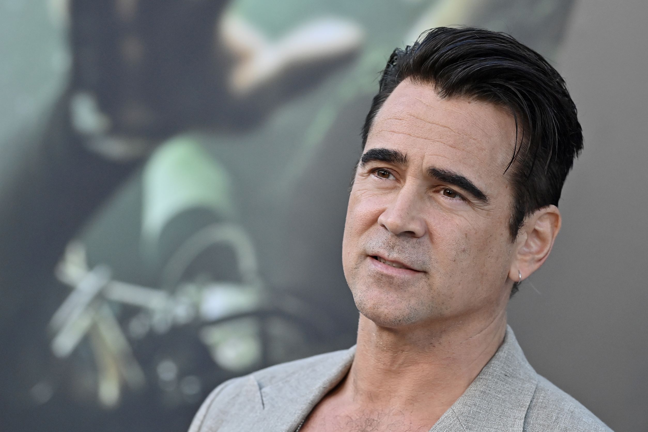 Colin Farrell, who is set to star in 'The Batman' spinoff series on HBO Max, wears a light gray suit.