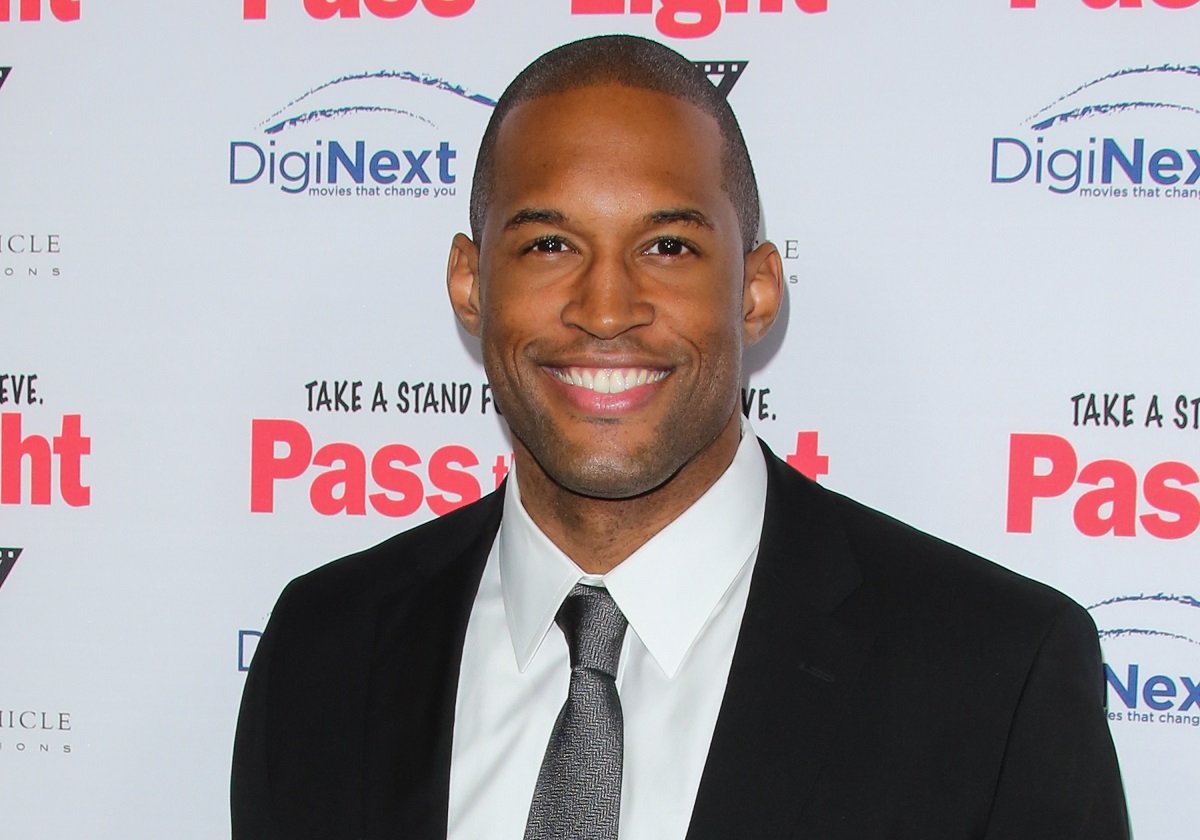 'The Bold and the Beautiful' star Lawrence Saint-Victor wearing a black suit during a red carpet appearance.