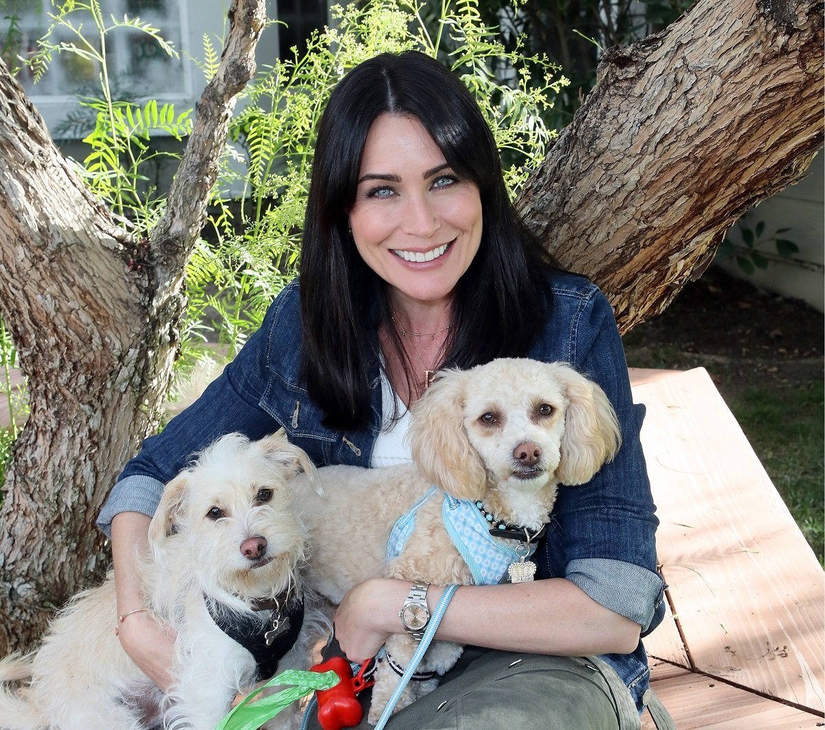 'The Bold and the Beautiful' star Rena Sofer poses with two dogs during a visit to Hallmark's 'Home & Family.'