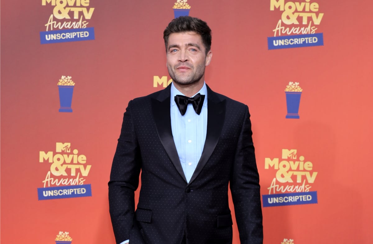 Challenge star CT Tamburello poses for the cameras in a tuxedo while GE attends the 2022 MTV Movie & TV Awards: UNSCRIPTED at Barker Hangar in Santa Monica, Calif. Broadcast June 5, 2022