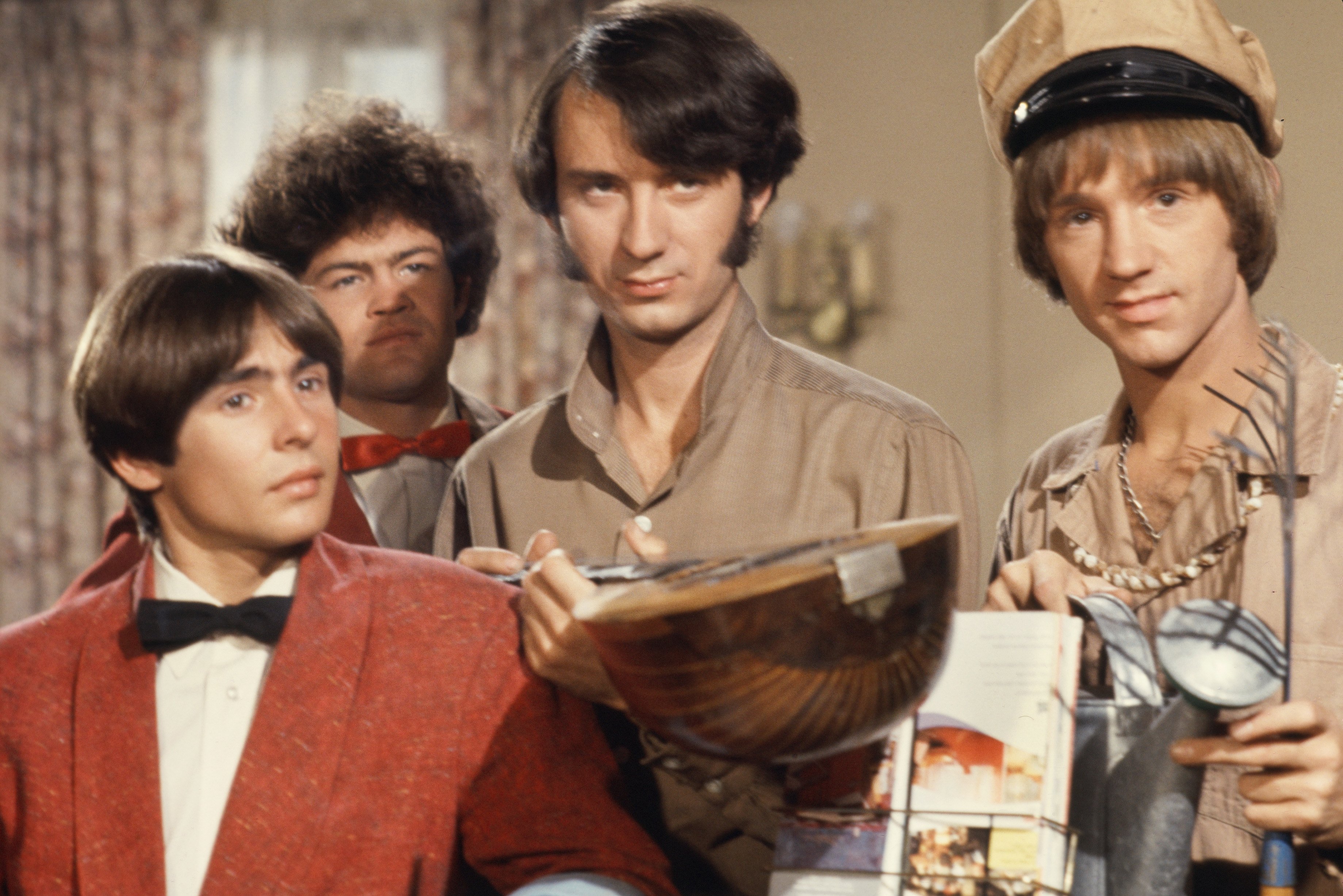 The Monkees' Davy Jones, Mickey Dolenz, Mike Nesmith, and Peter Tork standing