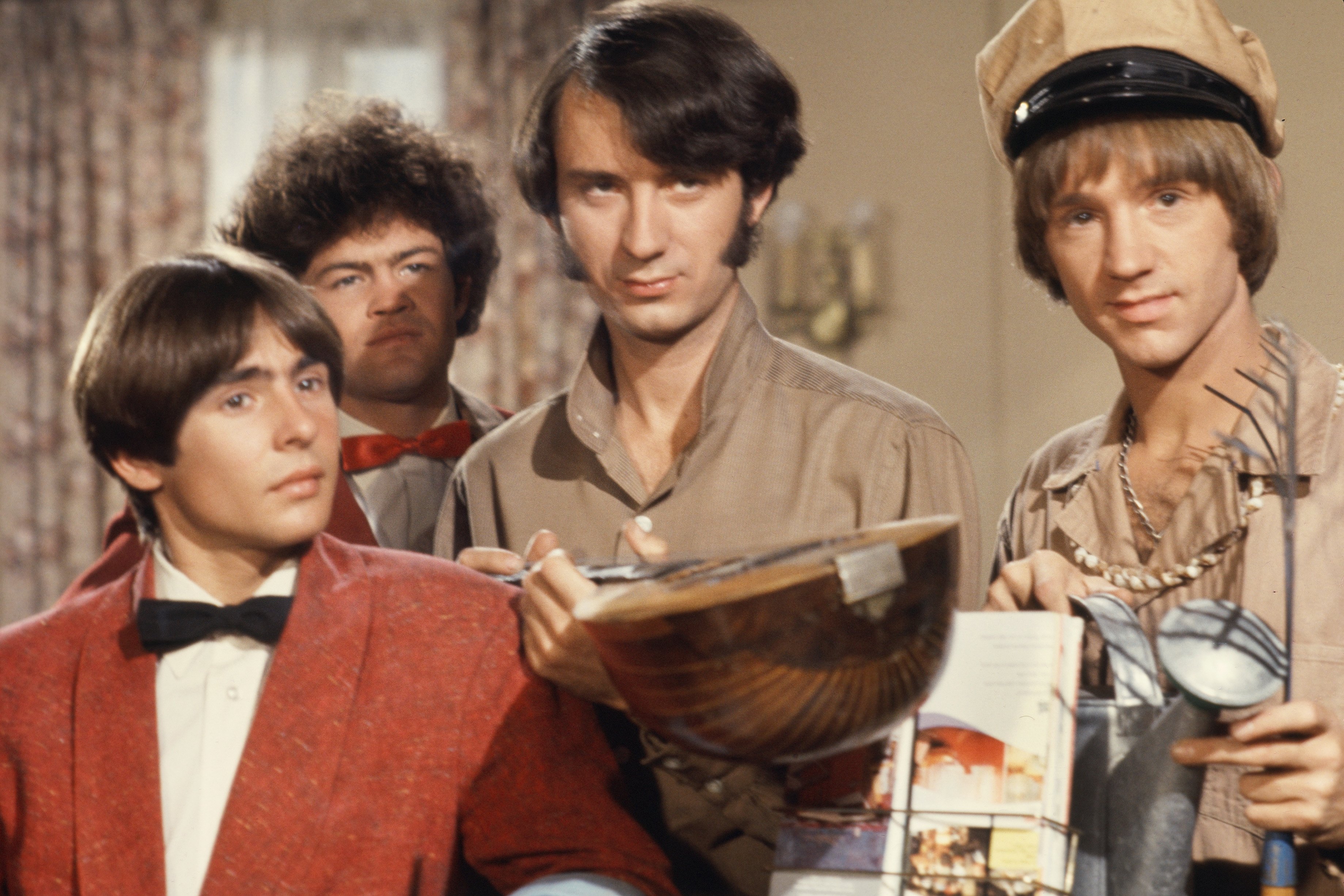 The Monkees' Davy Jones, Micky Dolenz, Mike Nesmith, and Peter Tork standing
