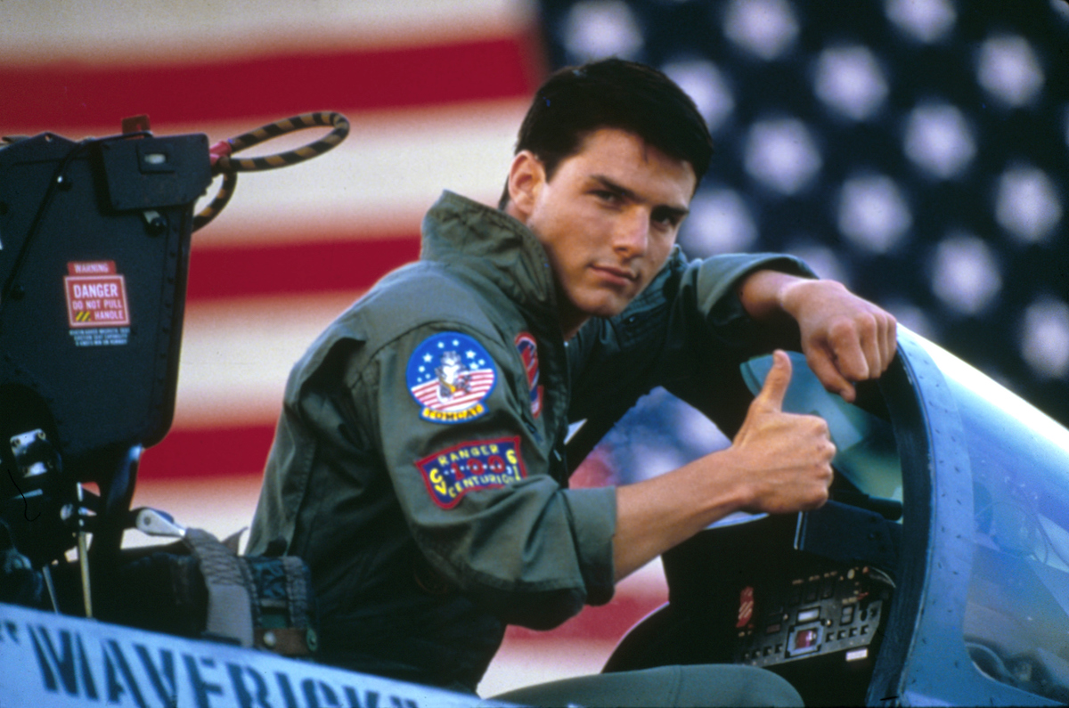 Tom Cruise, who has a $600 million net worth, gives a thumbs up on the set of 'Top Gun'