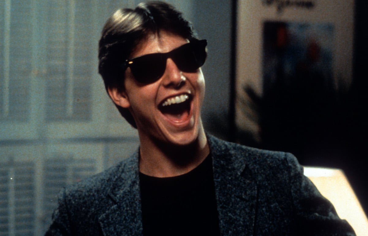 Tom Cruise, whose net worth is $600 million, laughs in 'Risky Business' in 1983