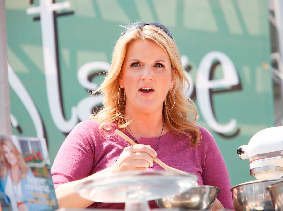 Trisha Yearwood, who has a delicious Caesar salad recipe, cooking at an event.