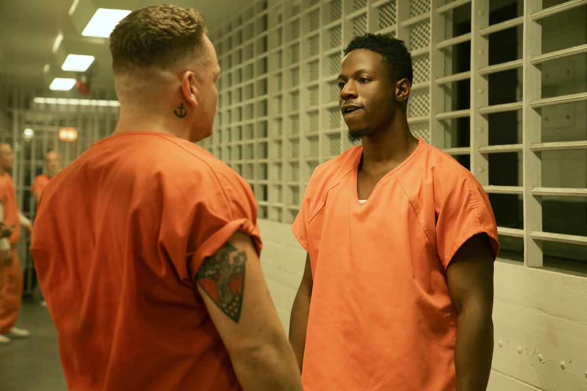 Joey Bada$$ as Unique wearing a orange prison jumpsuit in 'Power Book III: Raising Kanan'