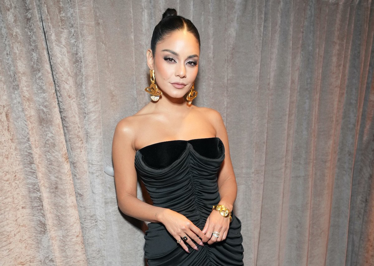 famous actor Vanessa Hudgens wears a black dress and gold earrings to the Tony Awards