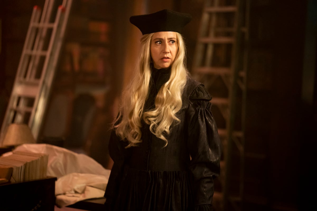 'What We Do in the Shadows' Season 4: Kristen Schaal wears a black robe and black hat as The Guide