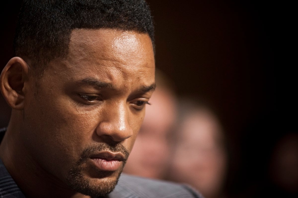 Will Smith listening while someone speaks.