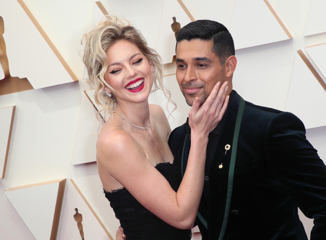 Amanda Pacheco and Wilmer Valderrama smiling at an event