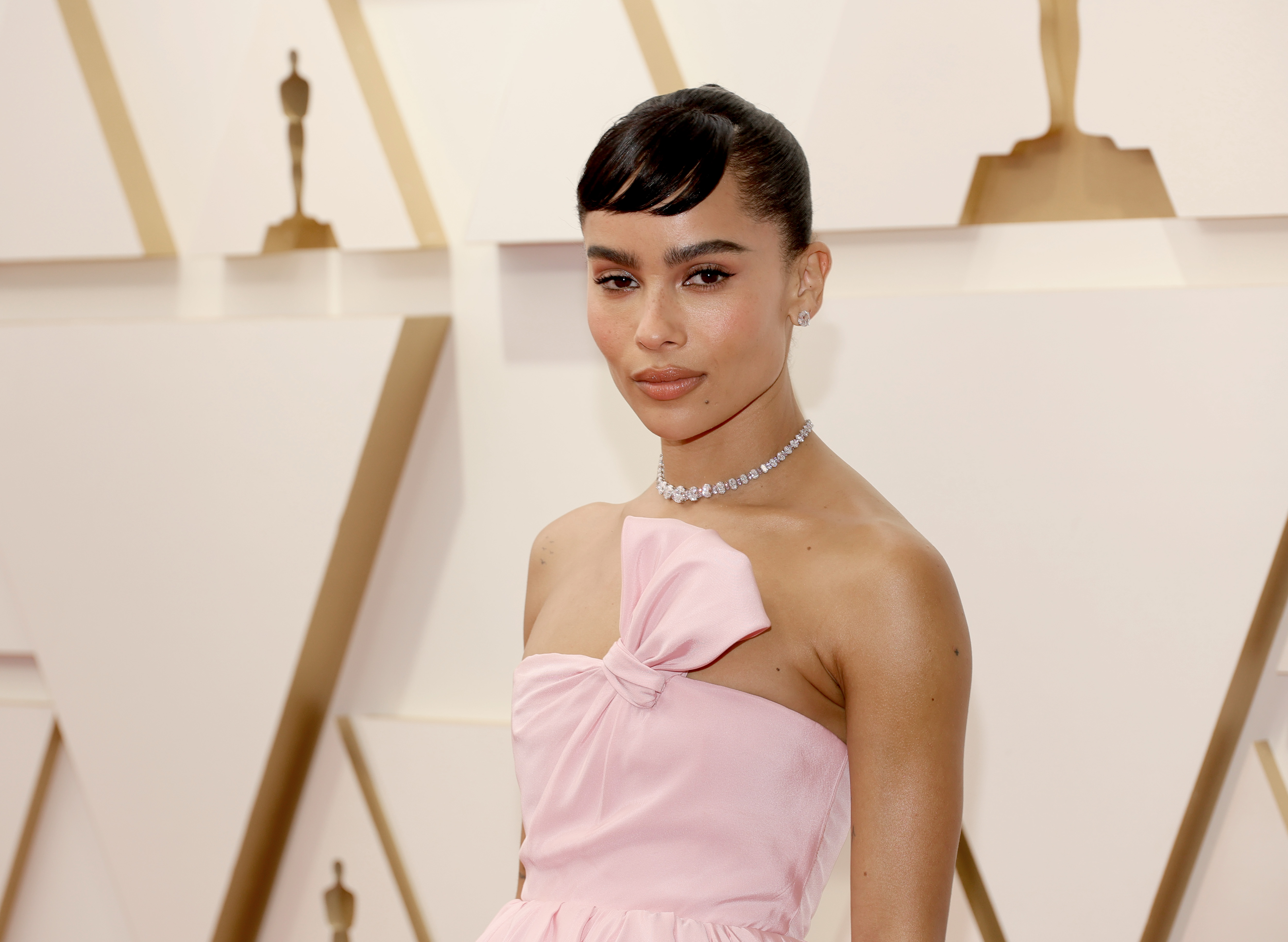Zoe Kravitz wears a pink dress at the Oscars.