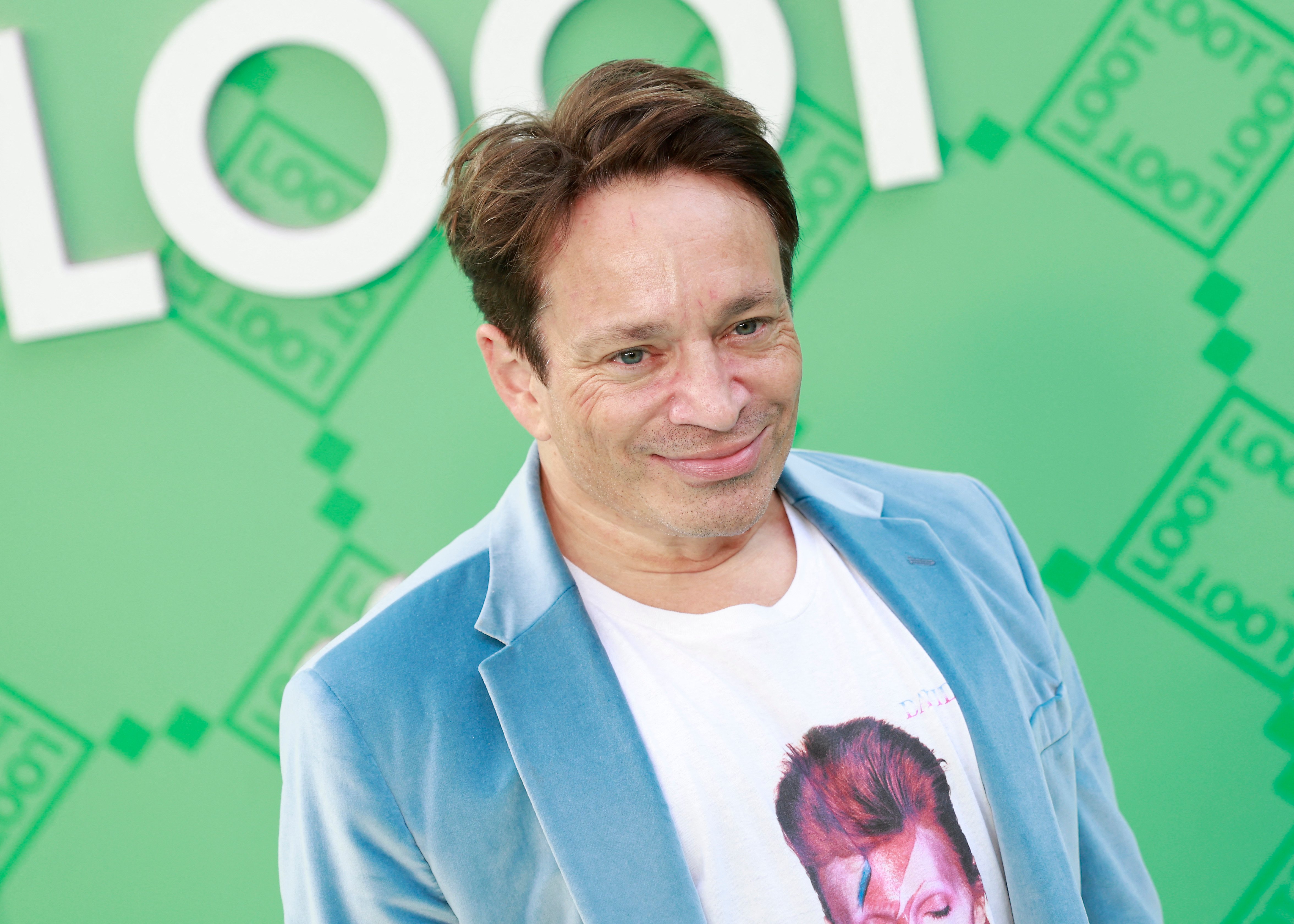 Chris Kattan, who didn't know his name was mentioned in Jordan Peele's 'Nope,' smiles at an event